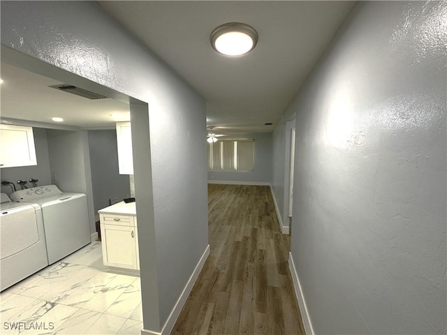 1376 Archer St Unit 6, Lehigh Acres, FL 33936 - hall with independent washer and dryer, a textured wall, baseboards, marble finish floor, and visible vents