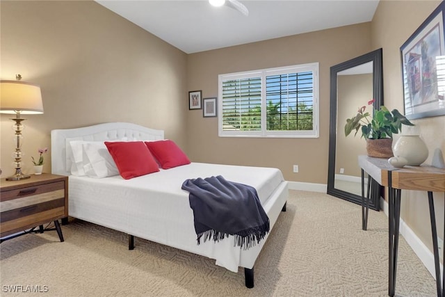 bedroom with carpet flooring, baseboards, and a ceiling fan