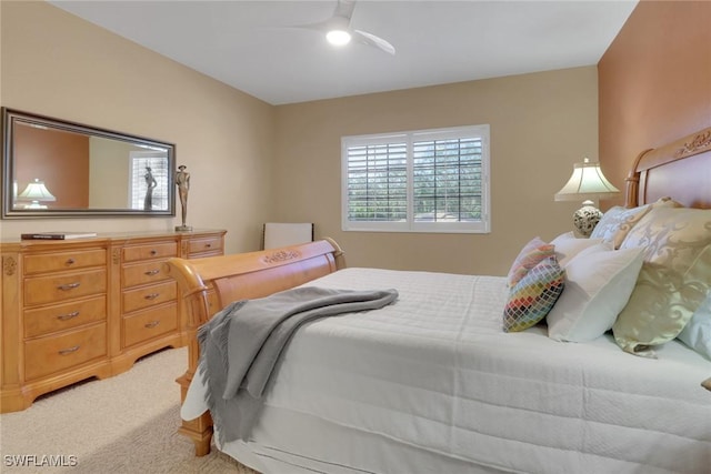 bedroom with light carpet and ceiling fan