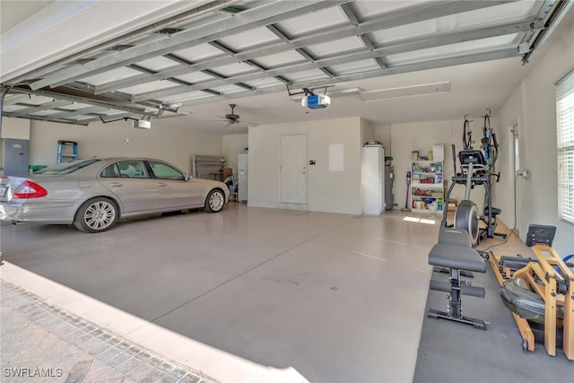 garage featuring a garage door opener, white fridge with ice dispenser, and electric panel