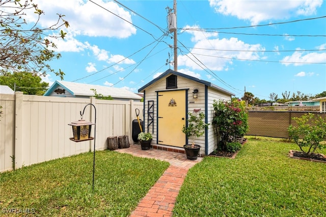 view of shed featuring a fenced backyard