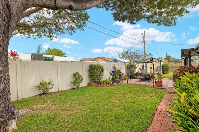 view of yard with a fenced backyard and a patio