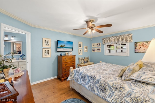 bedroom featuring baseboards, ornamental molding, wood finished floors, and a ceiling fan