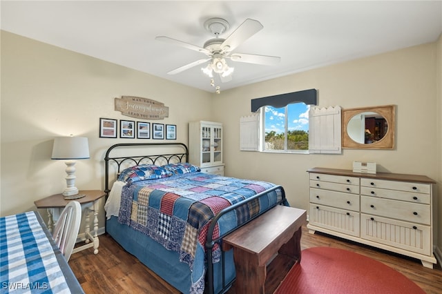 bedroom featuring wood finished floors and a ceiling fan
