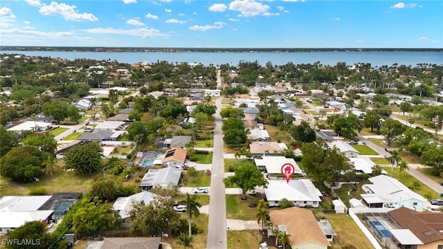 birds eye view of property with a residential view and a water view
