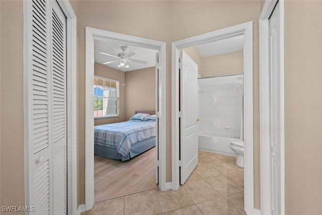 corridor featuring light tile patterned floors
