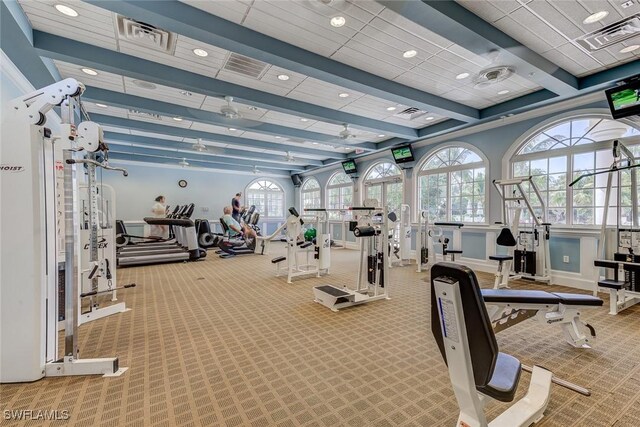 gym featuring carpet flooring, visible vents, and plenty of natural light