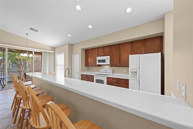 kitchen featuring light tile patterned flooring, a notable chandelier, white appliances, visible vents, and recessed lighting