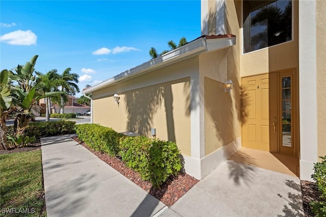 view of side of home featuring stucco siding
