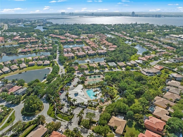 drone / aerial view featuring a residential view and a water view