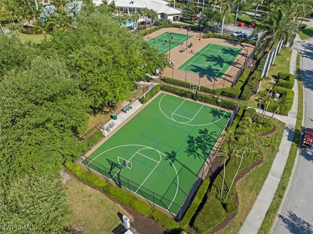 view of basketball court with community basketball court and fence