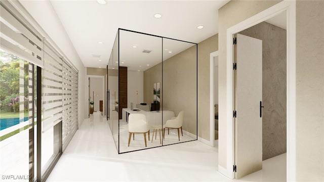 hallway with visible vents and recessed lighting