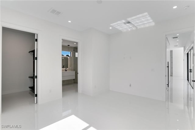 unfurnished room with visible vents and recessed lighting