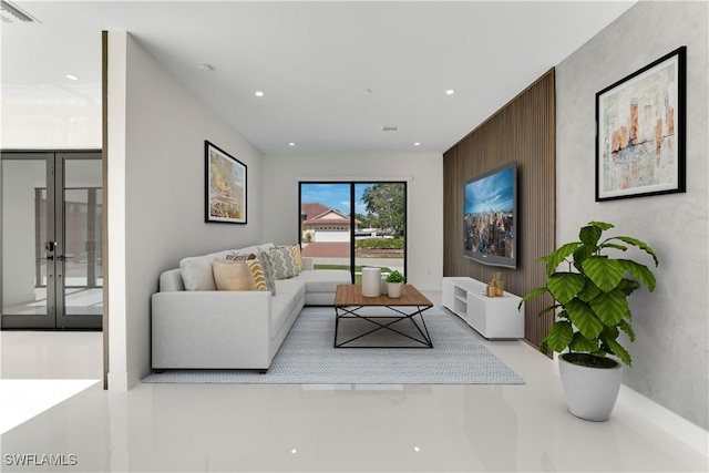 living area with french doors, visible vents, and recessed lighting