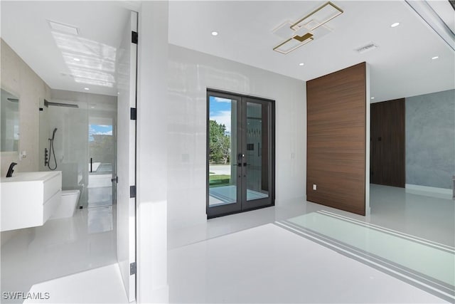interior space featuring recessed lighting, visible vents, toilet, vanity, and a walk in shower