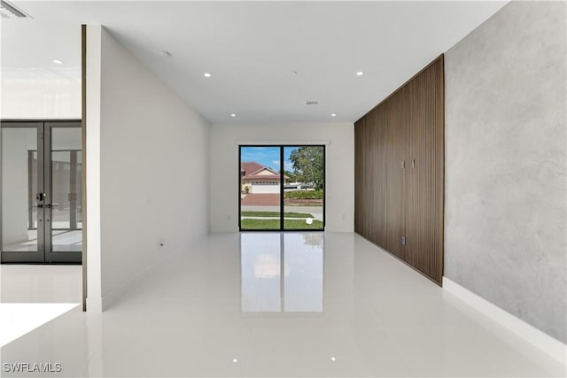 unfurnished room featuring french doors, visible vents, and recessed lighting