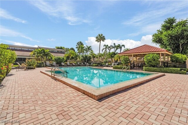 4855 Dockside Dr Unit 204, Fort Myers, FL 33919 - community pool featuring a gazebo and a patio area