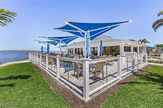 4855 Dockside Dr Unit 204, Fort Myers, FL 33919 - view of patio featuring a deck with water view and outdoor dining space