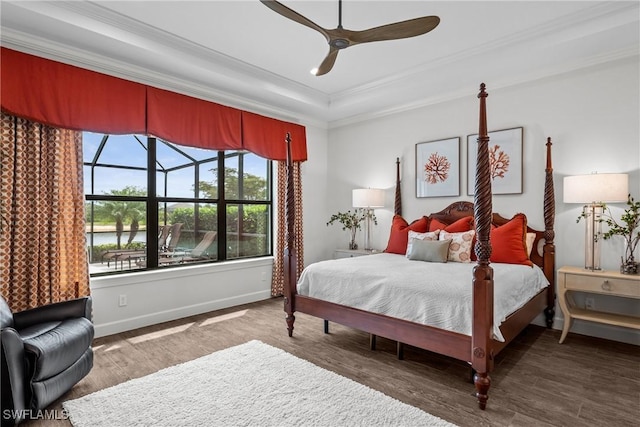 9476 Livorno Ct, Naples, FL 34119 - bedroom featuring wood finished floors, ornamental molding, a sunroom, a raised ceiling, and ceiling fan