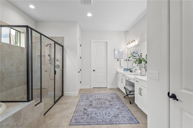 9476 Livorno Ct, Naples, FL 34119 - full bathroom with vanity, a stall shower, recessed lighting, tile patterned floors, and a relaxing tiled tub