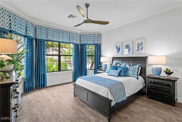 9476 Livorno Ct, Naples, FL 34119 - bedroom featuring crown molding, wood finished floors, and a ceiling fan