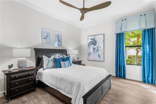 9476 Livorno Ct, Naples, FL 34119 - bedroom featuring crown molding, wood finished floors, and a ceiling fan