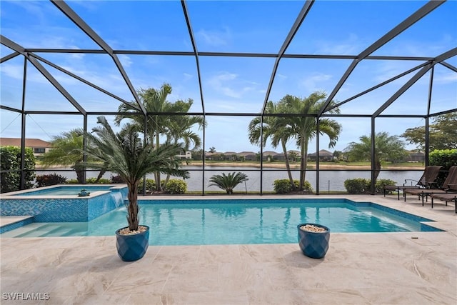 9476 Livorno Ct, Naples, FL 34119 - view of swimming pool featuring a patio area, a water view, a pool with connected hot tub, and glass enclosure