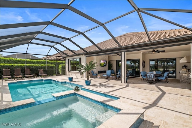 9476 Livorno Ct, Naples, FL 34119 - view of swimming pool with a ceiling fan, a patio area, a pool with connected hot tub, outdoor lounge area, and a lanai