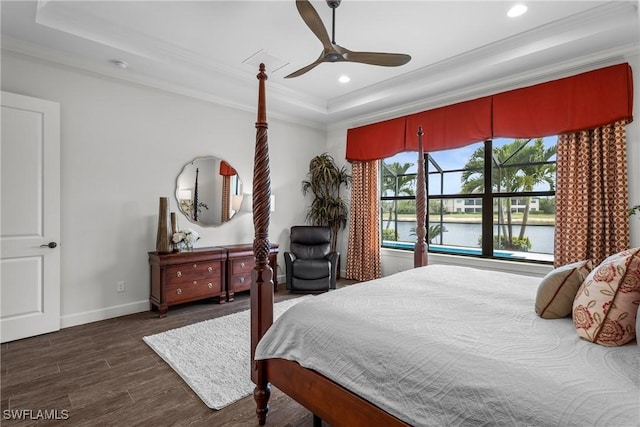9476 Livorno Ct, Naples, FL 34119 - bedroom featuring a tray ceiling, ornamental molding, wood finished floors, recessed lighting, and ceiling fan