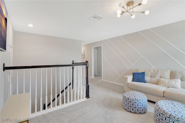 living area with carpet flooring, a chandelier, baseboards, an upstairs landing, and visible vents