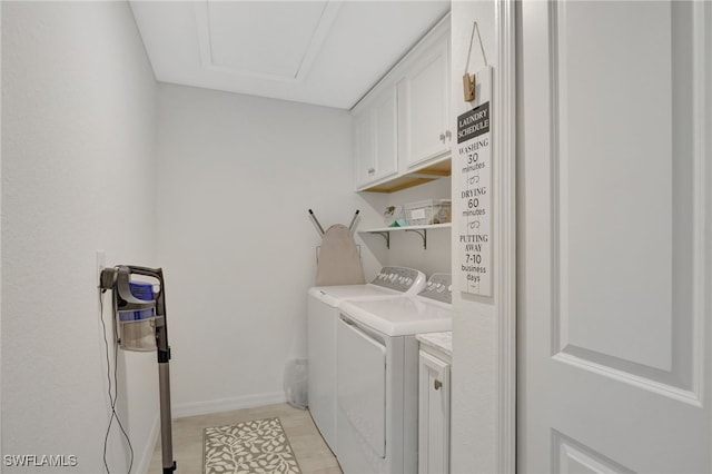 laundry room with baseboards, cabinet space, and washing machine and dryer