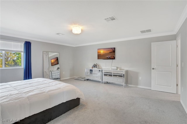 bedroom featuring crown molding, carpet flooring, visible vents, and baseboards