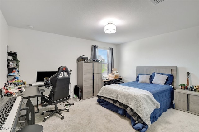 bedroom featuring carpet flooring and visible vents