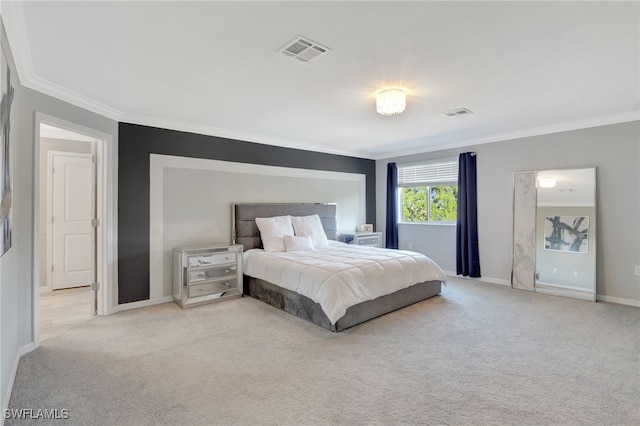 bedroom with visible vents, ornamental molding, baseboards, and light colored carpet