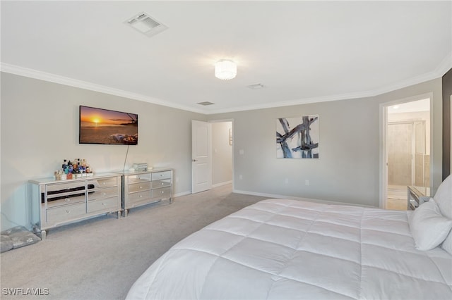 carpeted bedroom featuring visible vents, baseboards, and crown molding