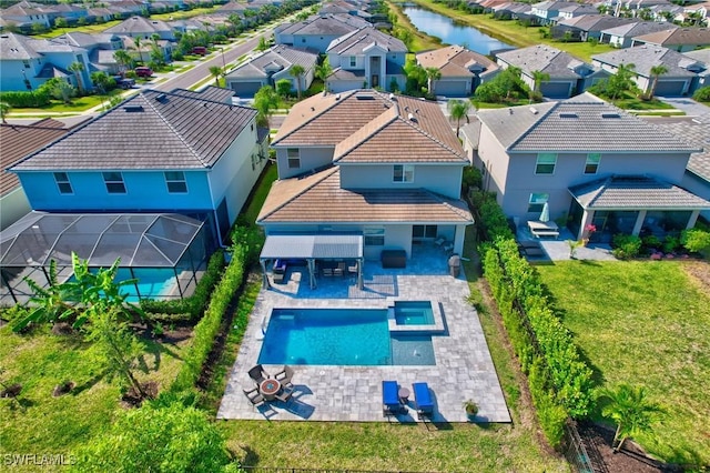 bird's eye view featuring a residential view and a water view