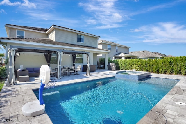 exterior space featuring an outdoor hangout area, a patio, and a pool with connected hot tub