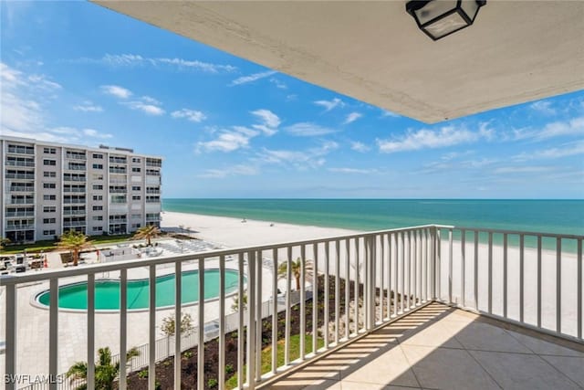 3443 Gulf Shore Blvd N Unit 403, Naples, FL 34103 - balcony with a water view and a view of the beach