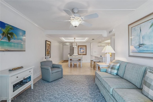 3443 Gulf Shore Blvd N Unit 403, Naples, FL 34103 - living area featuring visible vents, ornamental molding, baseboards, a tray ceiling, and a ceiling fan