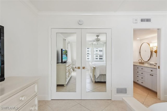 3443 Gulf Shore Blvd N Unit 403, Naples, FL 34103 - ensuite bathroom with connected bathroom, vanity, french doors, visible vents, and ornamental molding