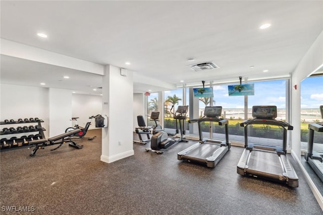 3443 Gulf Shore Blvd N Unit 403, Naples, FL 34103 - gym with recessed lighting, baseboards, visible vents, and floor to ceiling windows