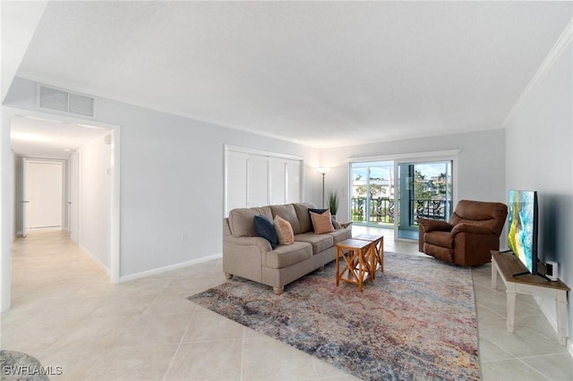 383 Harbour Dr Unit 209, Naples, FL 34103 - living area featuring light tile patterned flooring and baseboards
