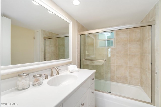383 Harbour Dr Unit 209, Naples, FL 34103 - bathroom with vanity and shower / bath combination with glass door