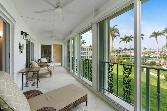 383 Harbour Dr Unit 209, Naples, FL 34103 - sunroom with ceiling fan and tile patterned flooring