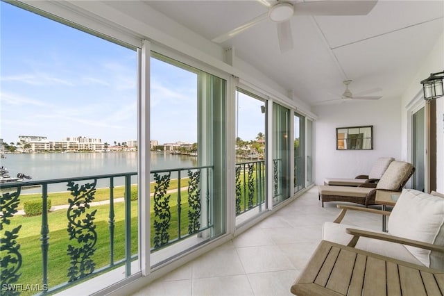 383 Harbour Dr Unit 209, Naples, FL 34103 - sunroom featuring a water view and tile patterned flooring