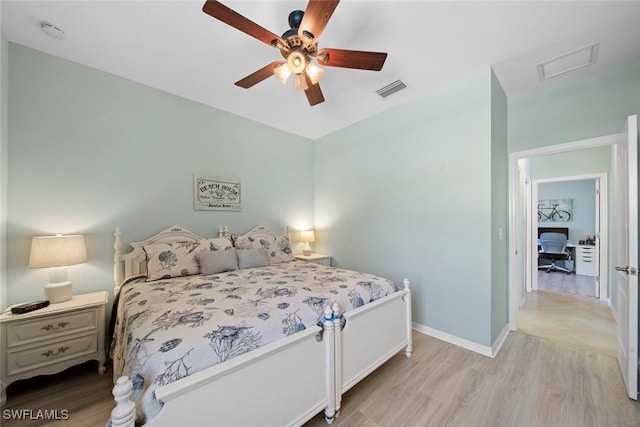 20374 Black Tree Ln, Estero, FL 33928 - bedroom featuring light wood finished floors, attic access, baseboards, and a ceiling fan