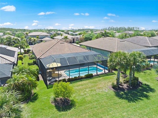 20374 Black Tree Ln, Estero, FL 33928 - outdoor pool featuring a residential view, a yard, and glass enclosure