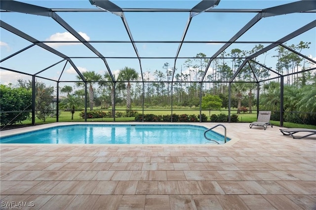 20374 Black Tree Ln, Estero, FL 33928 - outdoor pool featuring a patio area, a lanai, and view of wooded area