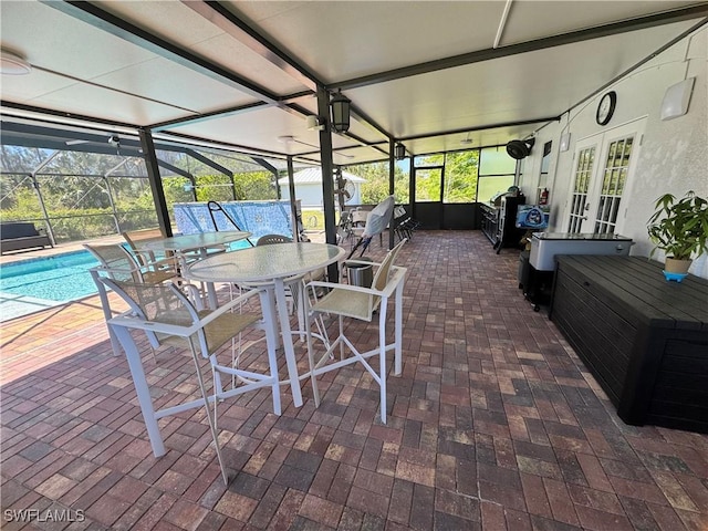 2618 35th Ave NE, Naples, FL 34120 - exterior space with outdoor dining area, french doors, and a healthy amount of sunlight