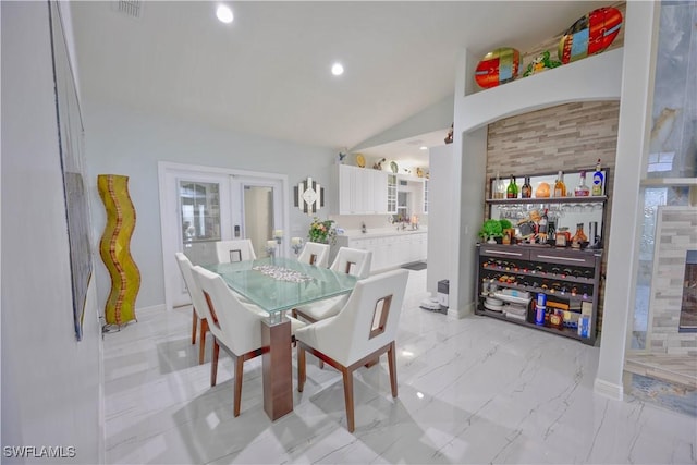 2618 35th Ave NE, Naples, FL 34120 - dining area featuring baseboards, recessed lighting, french doors, and lofted ceiling